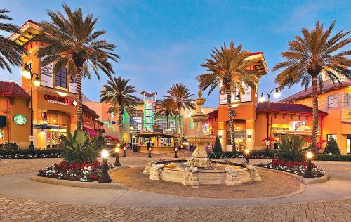 a fountain in the middle of a street with palm trees at Destiny Beach Villas #20A in Destin