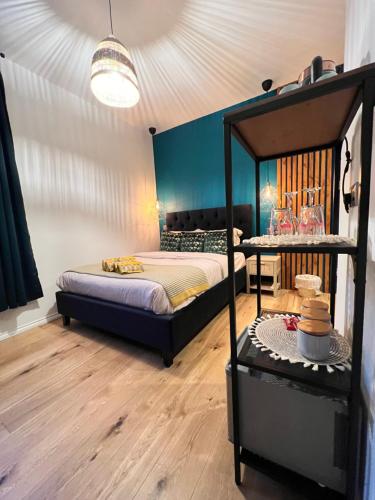 a bedroom with a bed and a table at Flamingo Lodge in Torquay