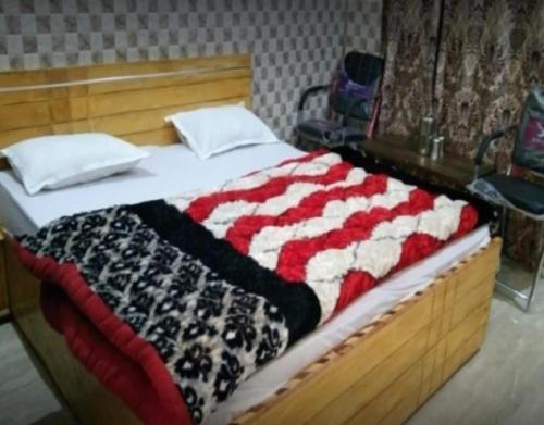 a bed with an american flag blanket on it at Tirath Niwas by StayApart in Kharsālī