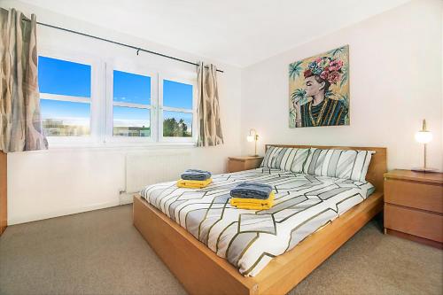 a bedroom with a large bed and a window at Bannermill Place Lodge ✪ Grampian Lettings Ltd in Aberdeen