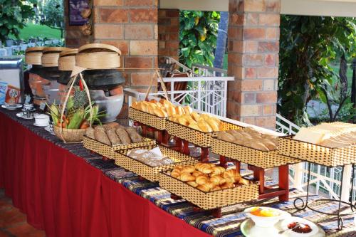 a buffet of bread and other foods on a table at Saigon Mui Ne Resort in Mui Ne
