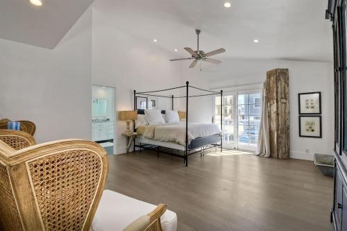 a bedroom with a bed and a ceiling fan at Luxury Ocean Views & Steps To The Sand - Tower 36 Upper Condo Unit in Carlsbad