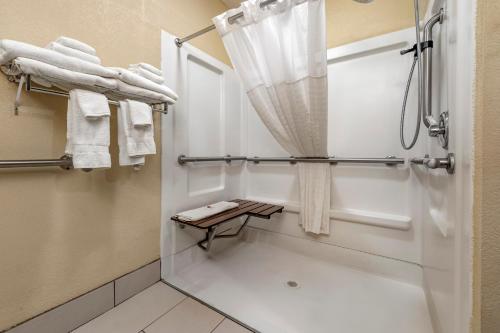 a bathroom with a shower with a shower curtain at Comfort Inn & Suites Hays I-70 in Hays