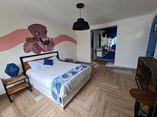 Postel nebo postele na pokoji v ubytování CASA NDOMI TEPOZ