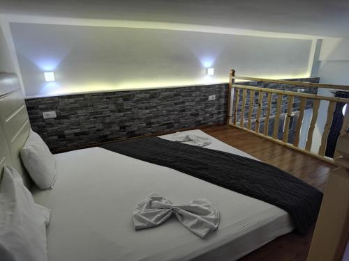 Ένα ή περισσότερα κρεβάτια σε δωμάτιο στο Vlycha Beach Apartments