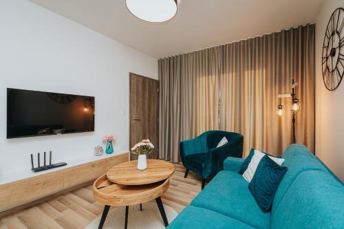 Телевизор и/или развлекательный центр в Apartmán Hillside X34, Kubínska Hoľa