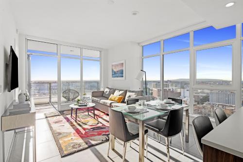 a living room with a couch and a table at Level Los Angeles - Downtown Flower in Los Angeles