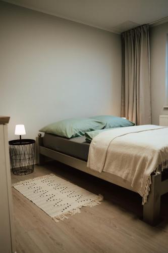 a bedroom with a bed and a window at Ferienwohnung Katharinenberg in Katharinenberg