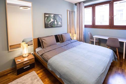 Posteľ alebo postele v izbe v ubytovaní Urban Jungle Apartment in the Citycenter
