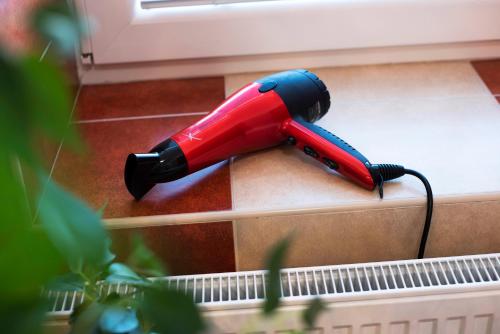 a red and blue umbrella sticking out of a box at Apartmán u Horynů - Sadová in Česká Třebová