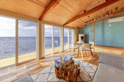 a living room with a view of the ocean at Nihonkai Yuhi Villa One Story - Vacation STAY 67117v 