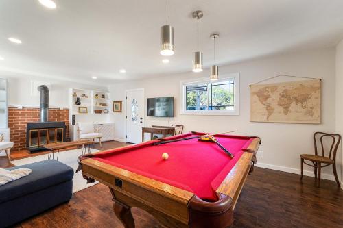 a living room with a pool table in it at Belaire BnB in Marble Falls