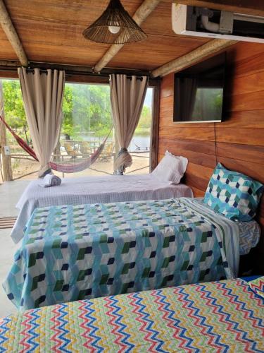 Postel nebo postele na pokoji v ubytování Bangalô Mangue Seco - Jericoacoara ce