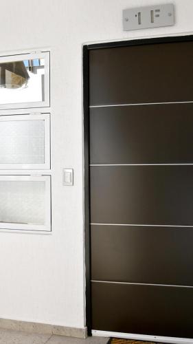 ajar door of a building with ajar door at Penthouse junto al mar in Manzanillo