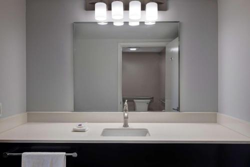 a bathroom with a sink and a mirror at Motel 6 Bonne Terre, MO in Bonne Terre