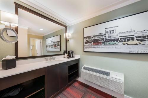 a bathroom with a sink and a mirror at BEST WESTERN the Inn of Los Gatos in Los Gatos