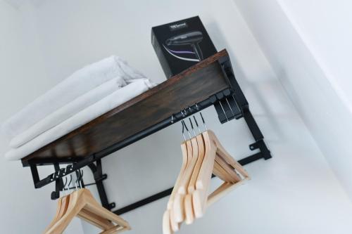 a wooden bench with forks and knives on it at Newark Central Cottage in Newark upon Trent