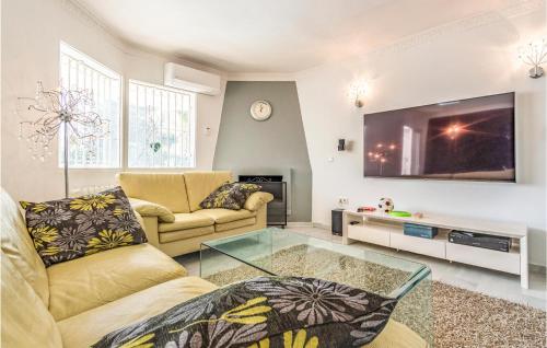 A television and/or entertainment centre at Gorgeous Apartment In Calahonda