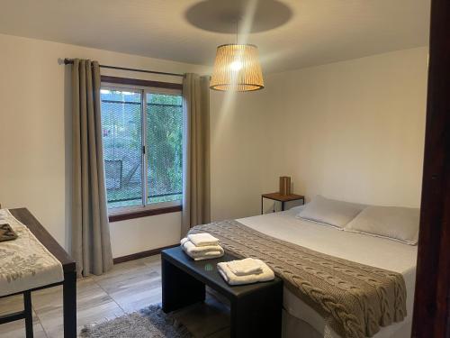 מיטה או מיטות בחדר ב-Patagonia Hope Suites
