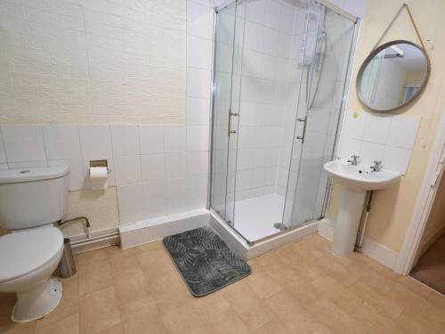 a bathroom with a shower and a toilet and a sink at Rose House Entire House WiFi 3 Bed Garden Maidstone - Kent in Maidstone