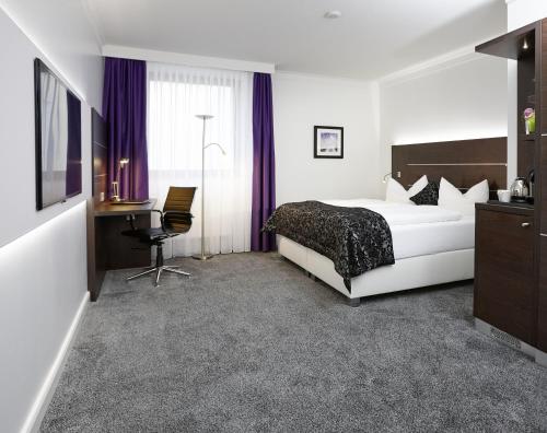 Ein Bett oder Betten in einem Zimmer der Unterkunft Central Hotel