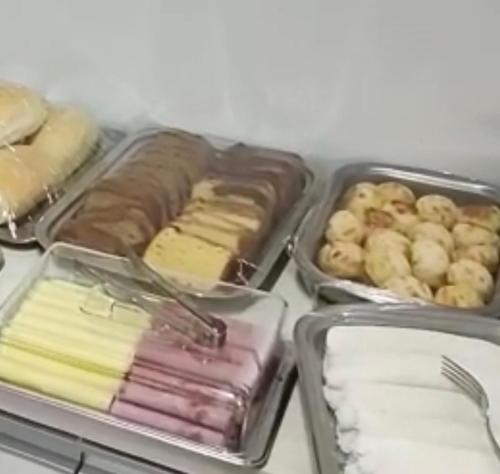 a group of trays filled with different types of food at Mauri Center Hotel in Picos