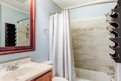a bathroom with a sink and a toilet and a shower at HH Beach & Tennis 245B in Hilton Head Island