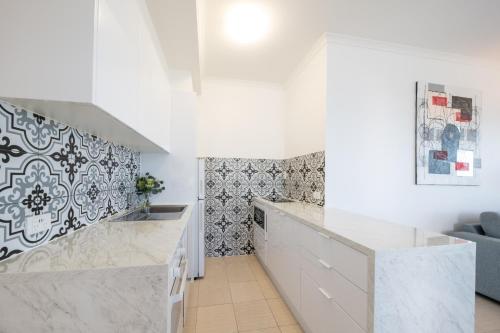 Voodi või voodid majutusasutuse Whitsunday Terraces Resort toas