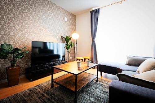 TV a/nebo společenská místnost v ubytování APHONGO HOTEL