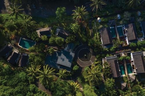 an overhead view of a resort with palm trees and a pool at The Samaya Ubud in Ubud