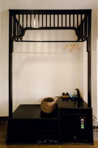 a black bunk bed with a black desk at The Fancy House in Quy Nhon