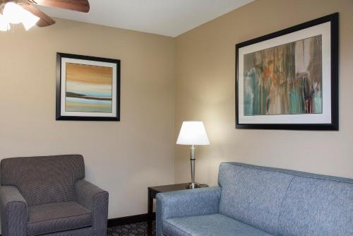 a living room with a couch and a chair at Holiday Inn Express Gas City by IHG in Gas City