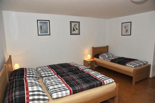 Postel nebo postele na pokoji v ubytování Chalupa Hořice na Šumavě