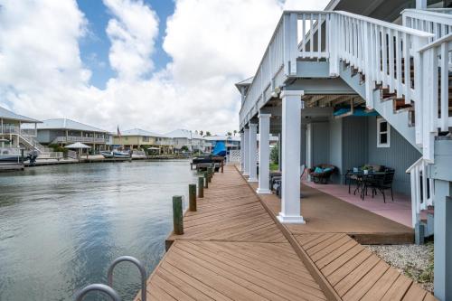 a house on the water with a dock at Edgewater Escape in Rockport