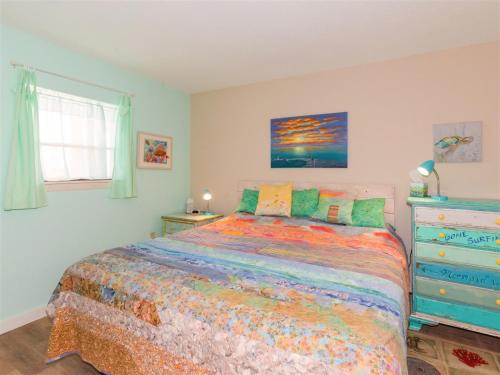 a bedroom with a large bed and a dresser at LR 403 - Destination Relaxation in Rockport