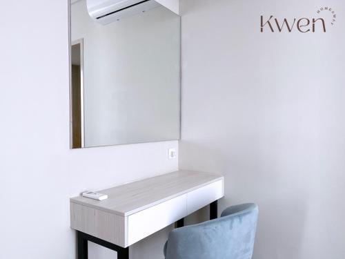 a bathroom with a sink and a mirror at KWEN Suites-Tanjung Aru InfinityPool Seaview/Airport View in Kota Kinabalu