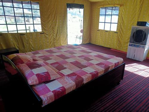 En eller flere senge i et værelse på Nayar Valley Retreat