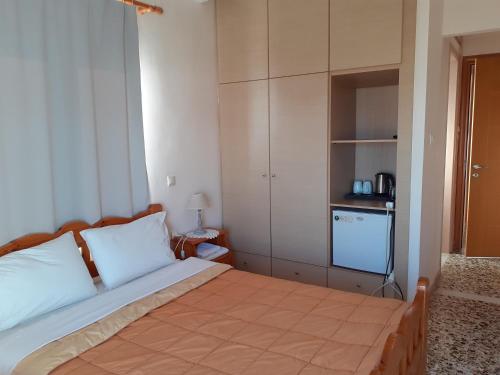 Postel nebo postele na pokoji v ubytování Kritikos Rooms