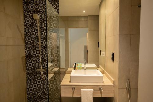 Ένα μπάνιο στο Kingsgate Al Jaddaf Hotel by Millennium