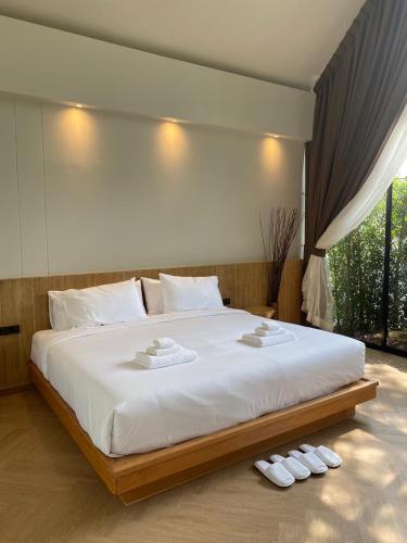 Ένα ή περισσότερα κρεβάτια σε δωμάτιο στο River Kwai Kiri Resort