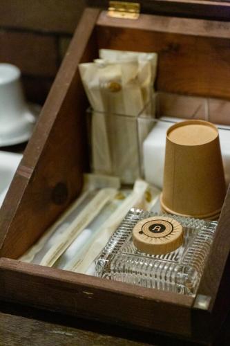 a wooden box with a roll of toilet paper in it at Bamba Hotel Tokyo-Private Townhouse- in Tokyo