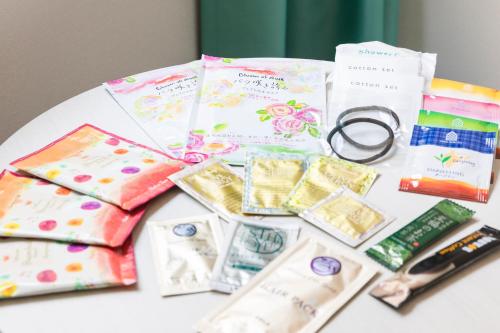 a table with a bunch of wrapping paper and scissors at Sotetsu Grand Fresa Kumamoto in Kumamoto
