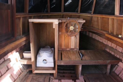 a outhouse with a toilet in the inside of it at ALTAIR . Wooden Boat . Cape Town in Cape Town