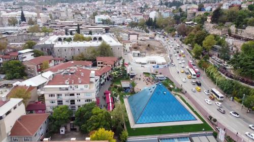 an aerial view of a city with a swimming pool at LOTUSPARK HOTEL in Bursa