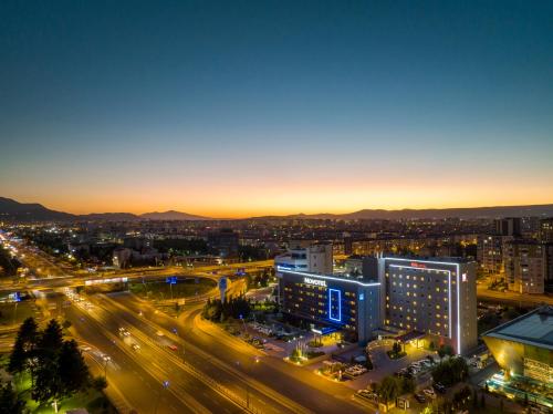 a city at night with traffic on a street at Ibis Kayseri in Kayseri