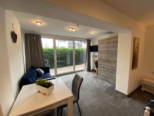 a living room with a table and a couch at Haus Dippel in Ruhpolding