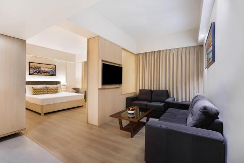 Postel nebo postele na pokoji v ubytování Keys Lite By Lemon Tree Hotels Sreekanya