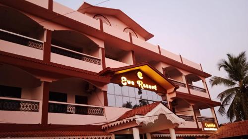 a hotel with a sign on the side of it at Eve Resort in Patnem