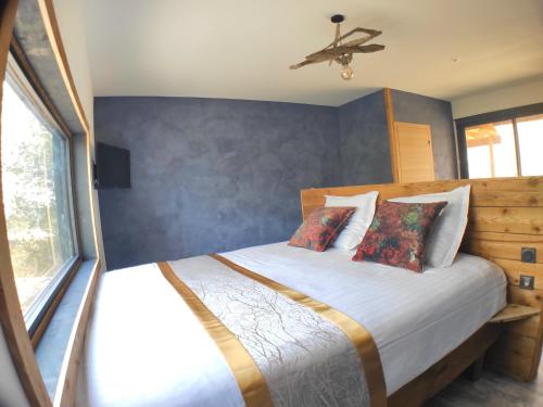 a bedroom with a bed and a ceiling fan at Villa Occitana in Calvisson
