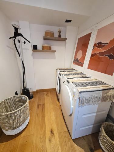 a washer and dryer in a room with a lamp at CHALET LA LOUVE, Courchevel 1650- 15 personnes Jacuzzi et Hammam Pistes 70 m,commerces 50m in Courchevel